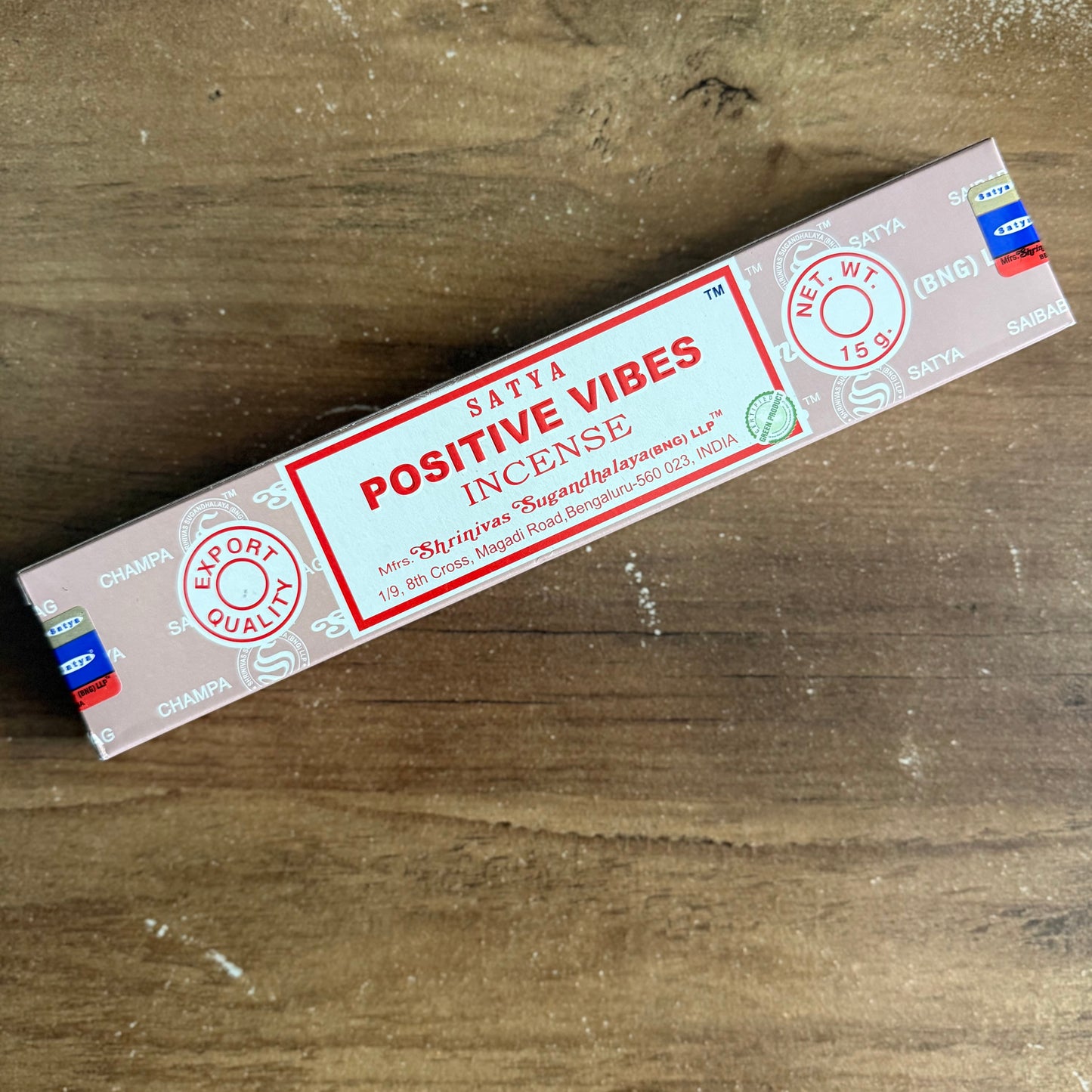 Box of Santa Positive Vibes Incense on a wooden surface