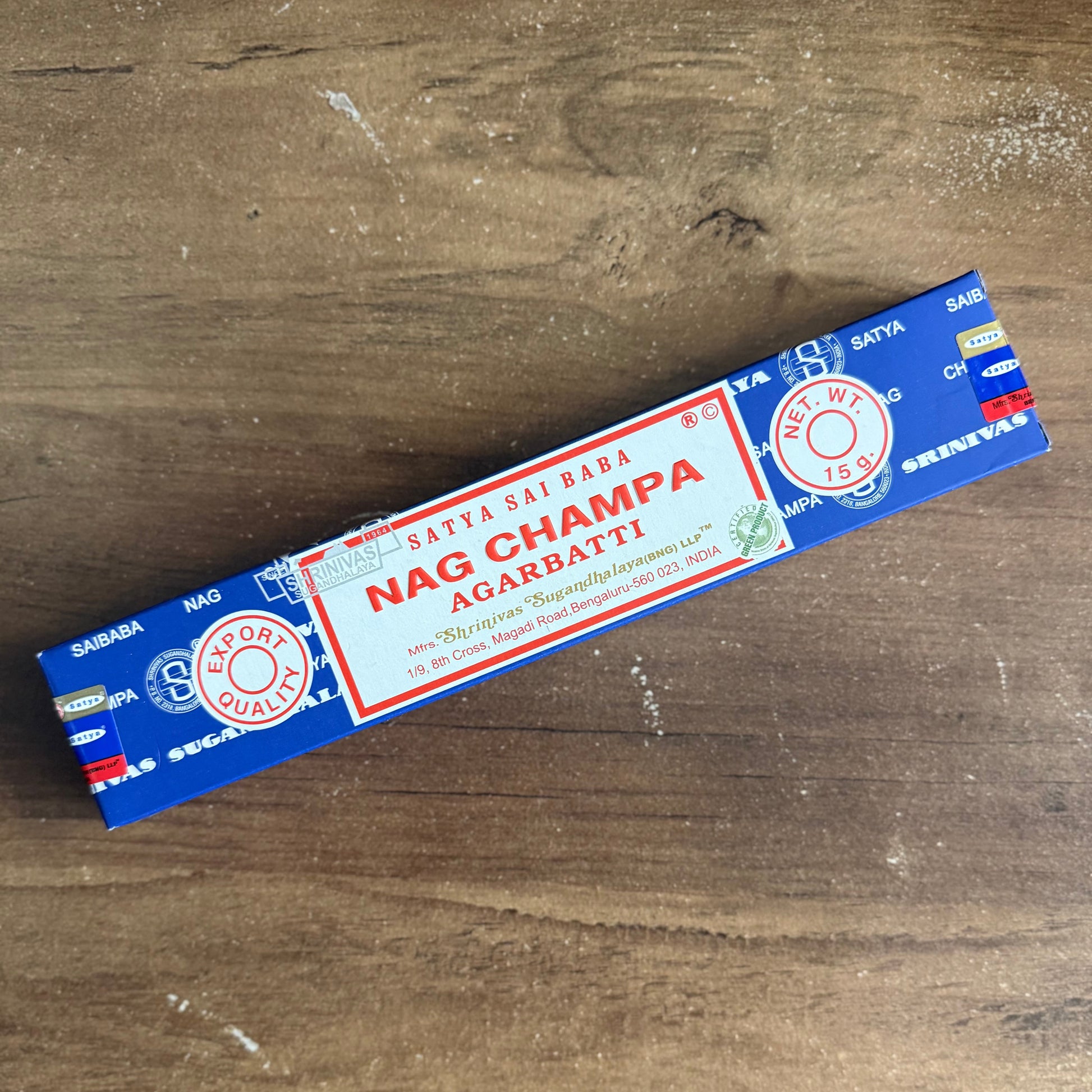 Satcha Sai Baba Nag Champa incense stick box on a wooden surface