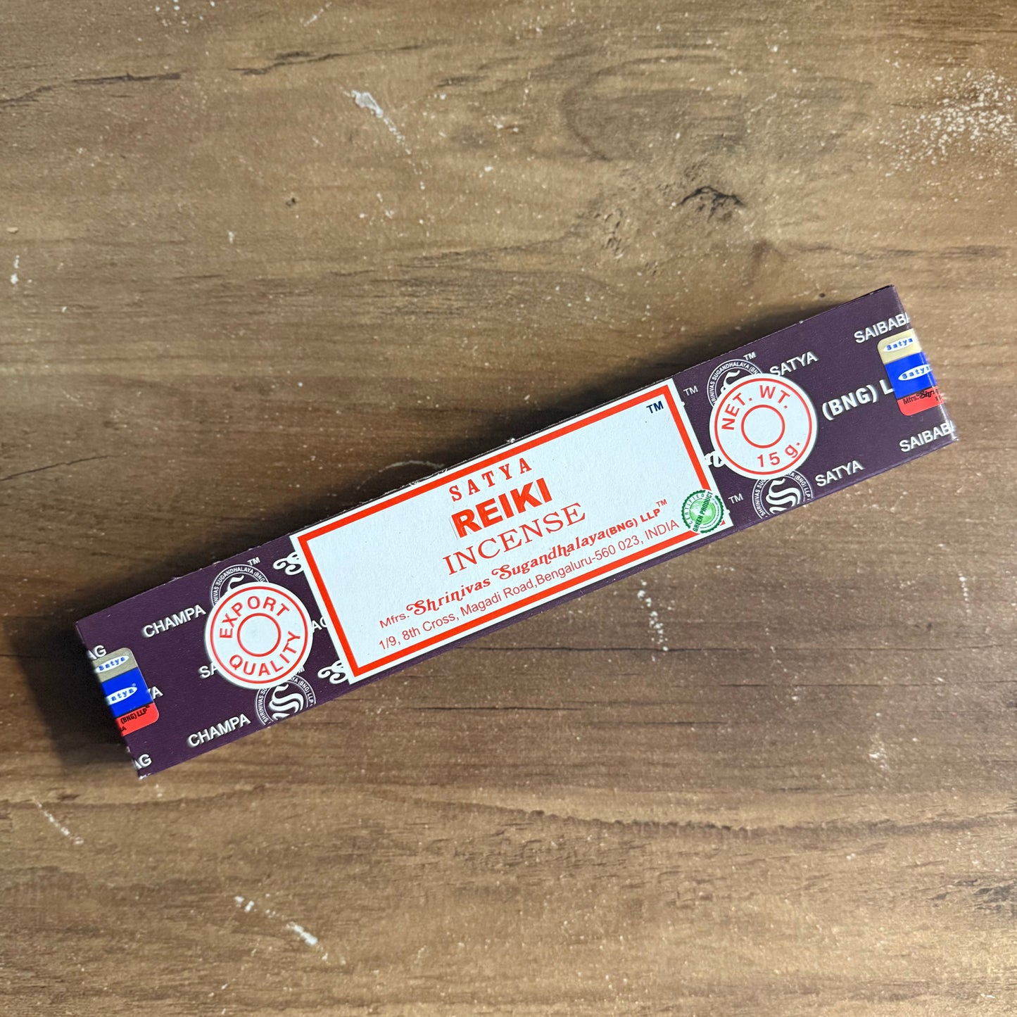 Box of Reiki incense on a wooden surface
