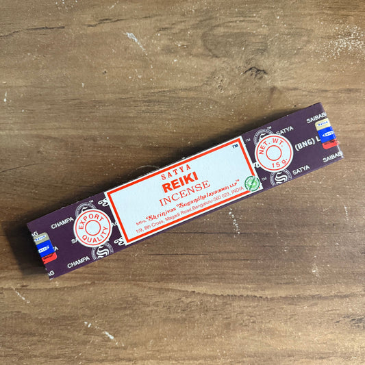 Box of Reiki incense on a wooden surface