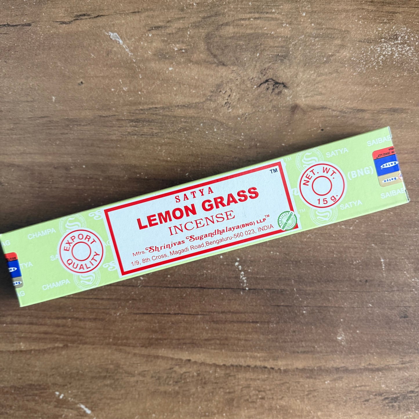 Saiya Lemon Grass incense packaging on a wooden surface