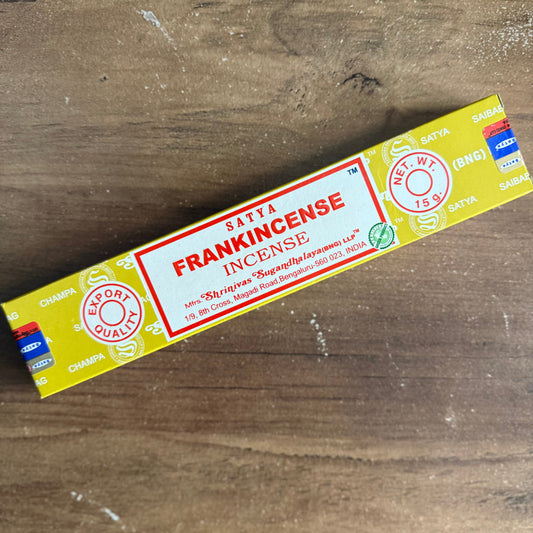 Satra frankincense incense packaging on a wooden surface