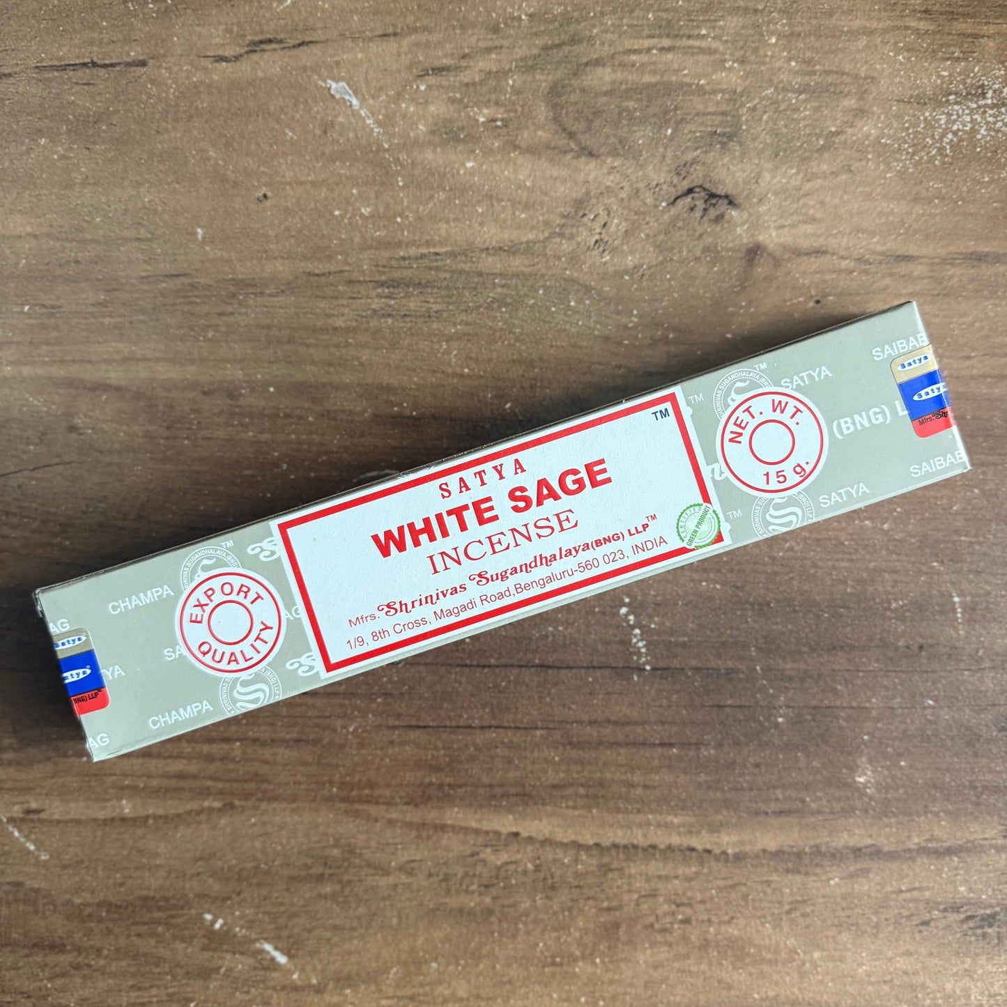 Box of Satya White Sage Incense on a wooden surface